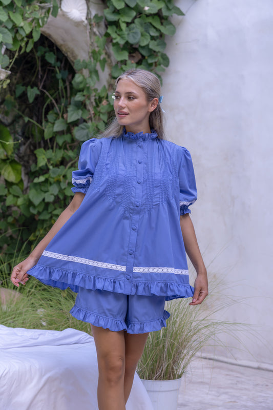 Model wearing the Alma Bluebelle Set, a periwinkle blue cotton short pyjama set by Love Letters x