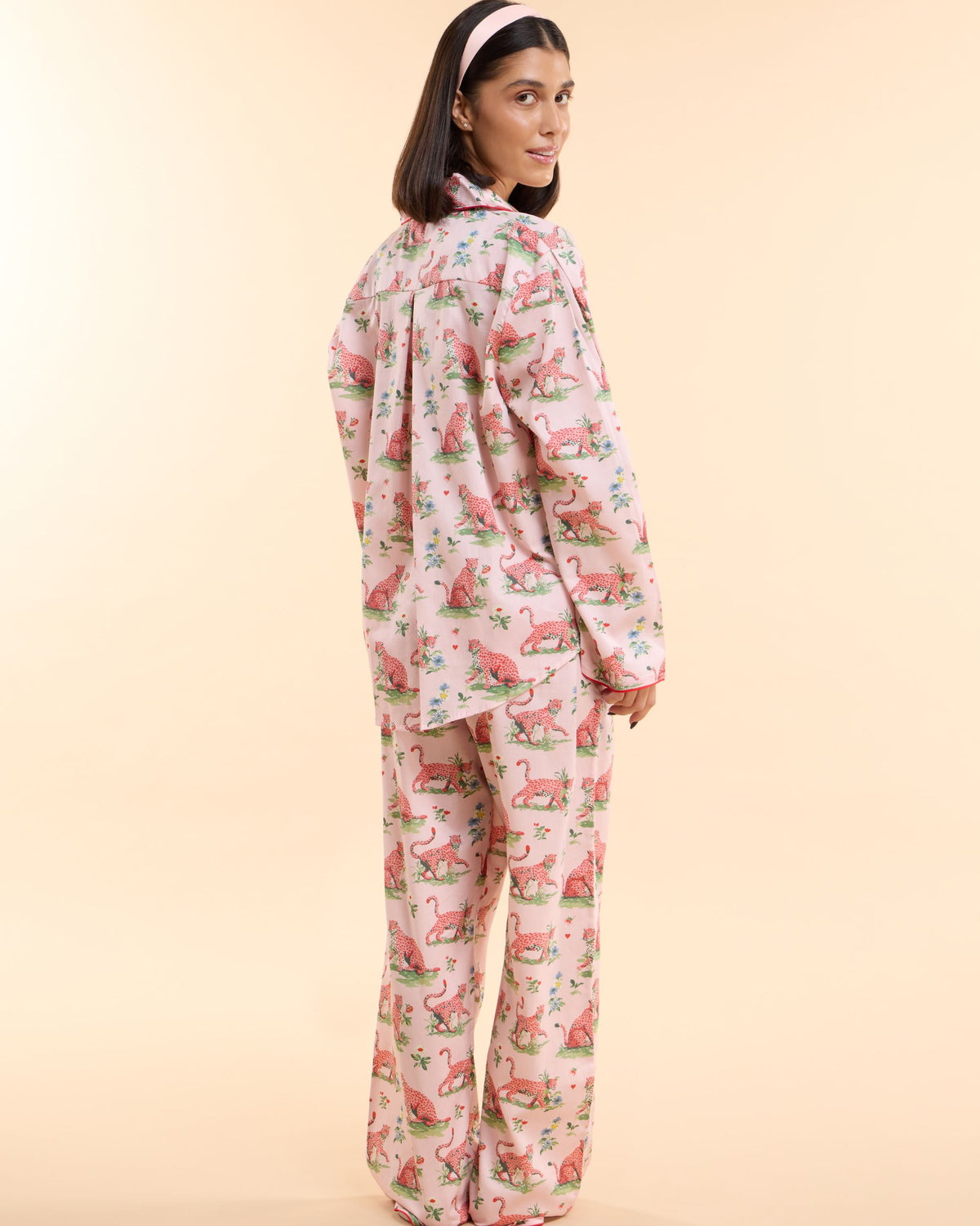 Three-quarter view of the Layla Pink Long PJ Set, oversized long-sleeve pyjama shirt and matching long trousers in pink leopard print