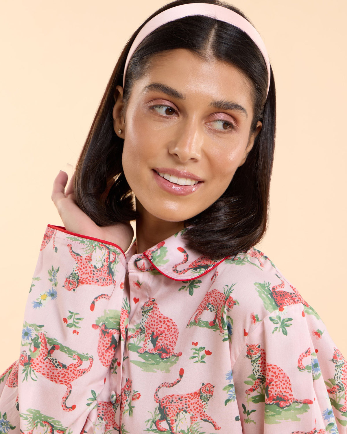 Detail of the Layla Pink pyjama shirt in blush pink leopard print with hearts, daisies and wildflowers, Love Letters x sleepwear