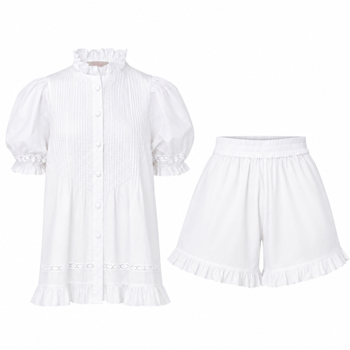 Alma Gardenia Set flat lay: white cotton pin-tuck top with frilled high collar and eyelet lace trim, with matching frilled shorts